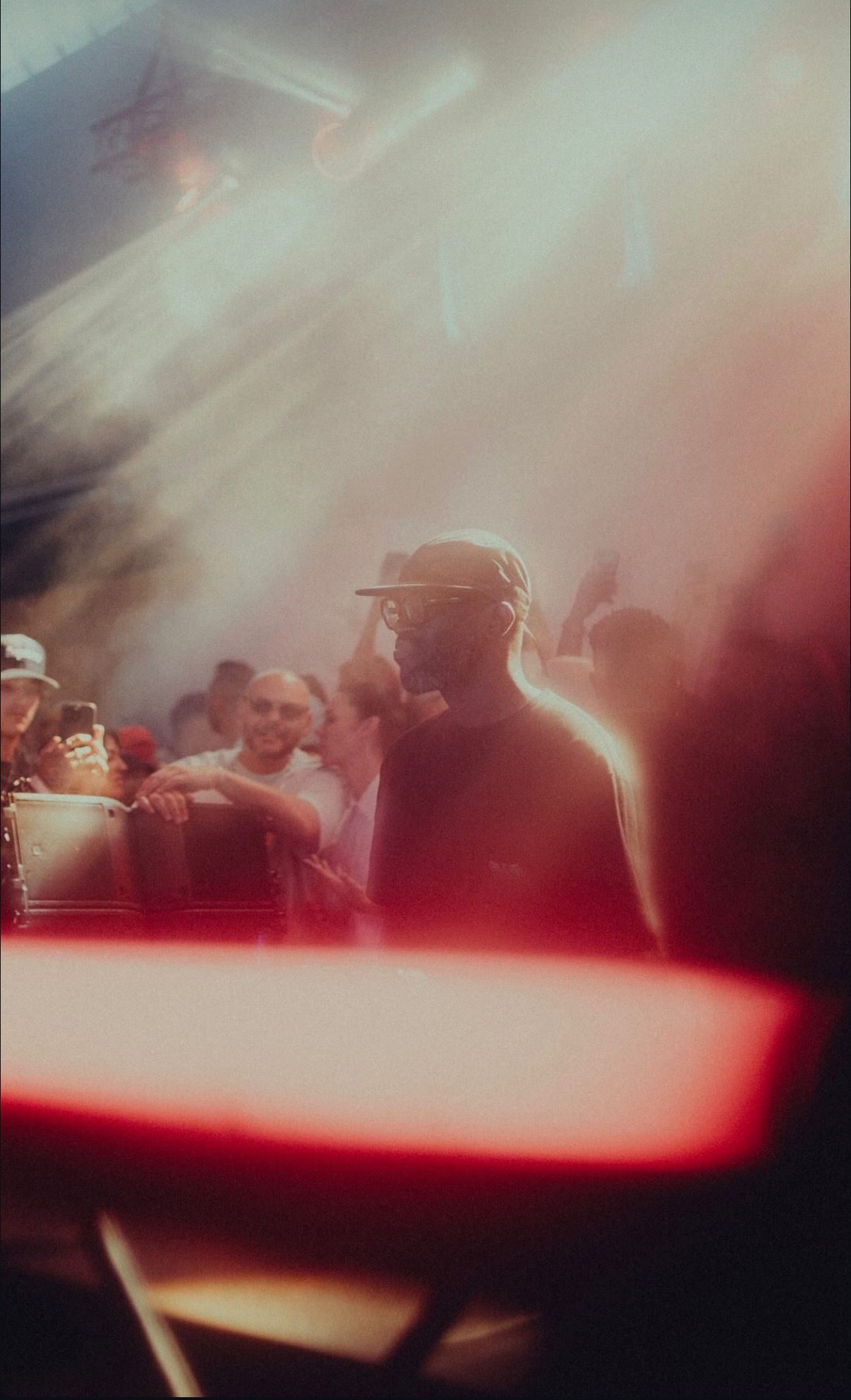 Black Coffee in the booth surrounded by smoke and light