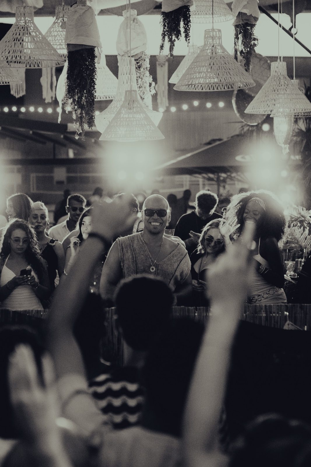 Francis Mercier smiling in the crowd at an open-air set