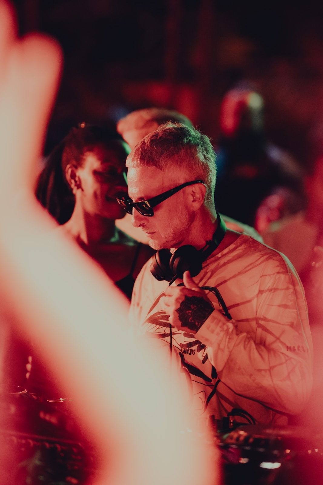 MoBlack behind the decks in red light